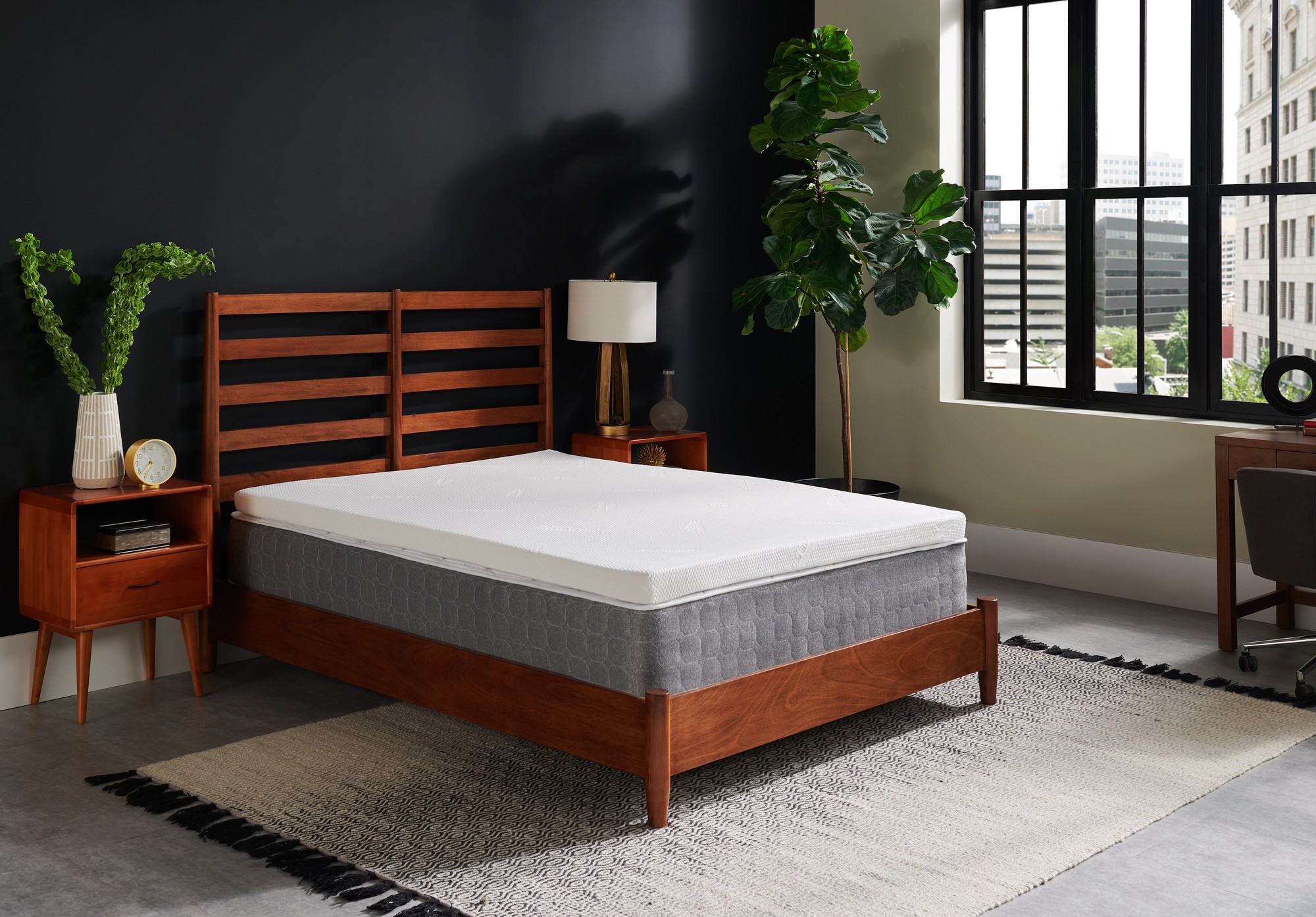 TEMPUR-Topper Supreme on a mattress in a styled room