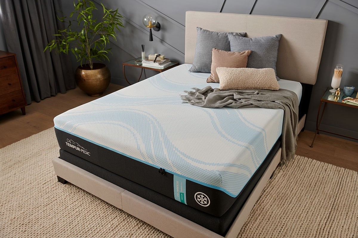 TEMPUR-Breeze Bare Mattress with pillows and blanket on top