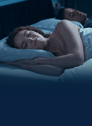 A woman sleeping in bed