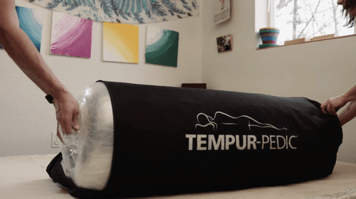 A Tempur-Cloud, mattress-in-bag, being taken out of its packaging