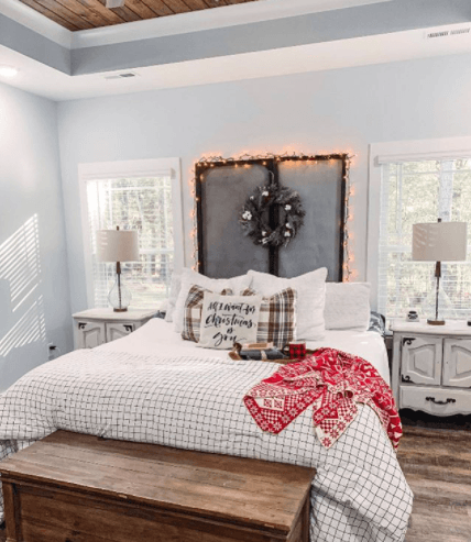 Decorated bedroom with christmas decor and tempur-pedic mattress with checkered bedding