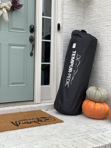 Tempur Cloud Bed In Bag Sitting On Porch next to pumpkins