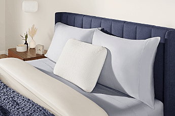 Symphony pillow on a styled bed