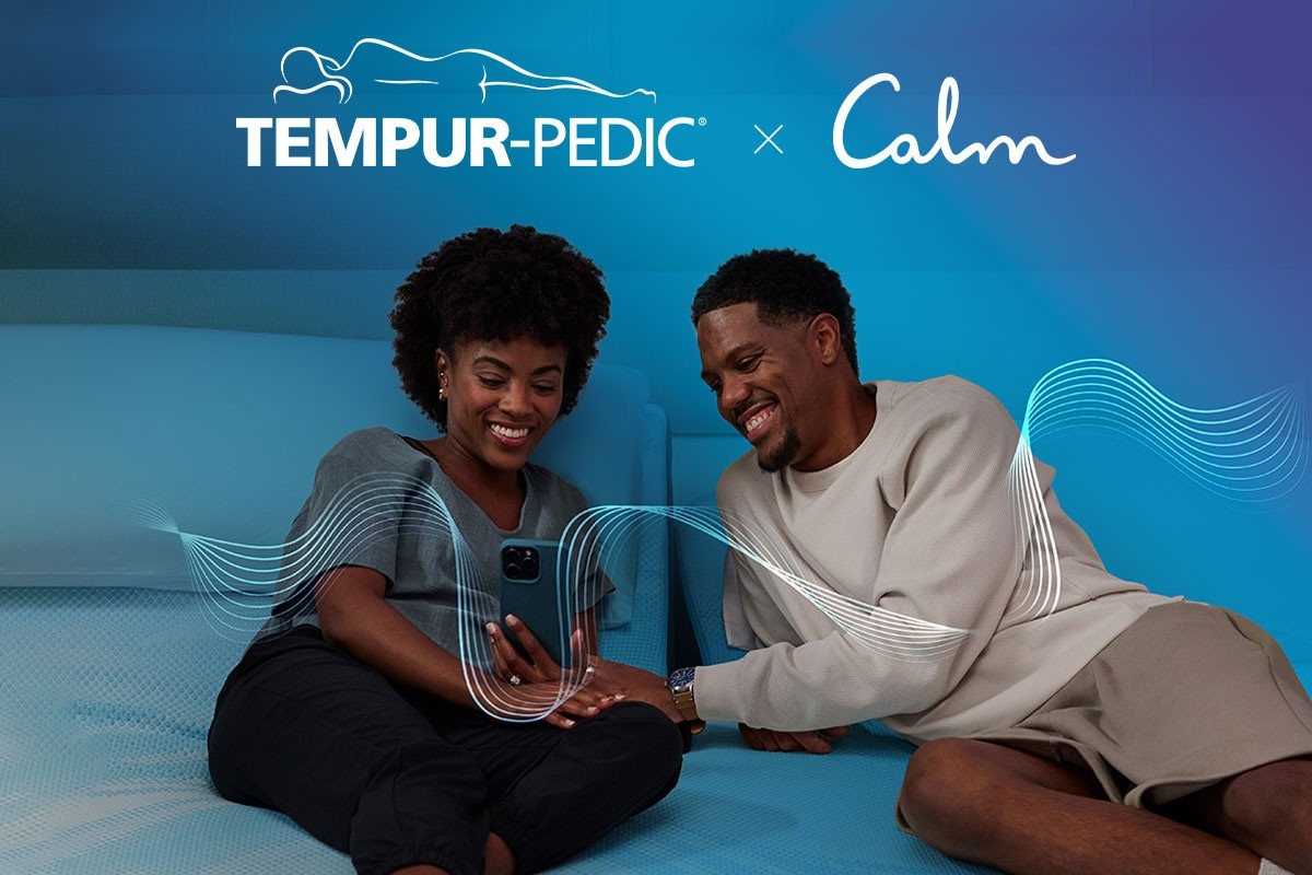 A couple using the Calm app while before bed
