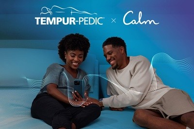 A couple using the Calm app while before bed