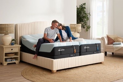 Couple sitting on split power base in decorated room