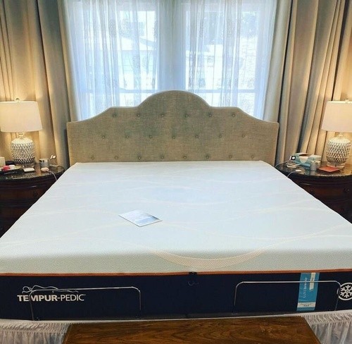 instagram photo of new Tempur-Pedic bed on a grey cloth frame