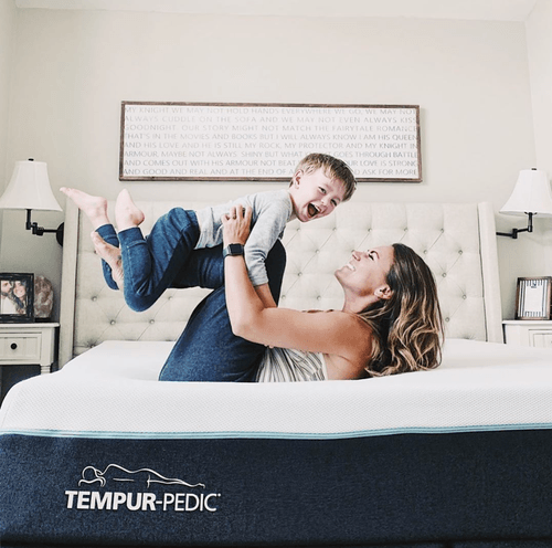 Mom with Son Smiling on Tempur-Breeze mattress