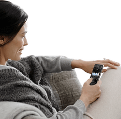A woman smiling while using the sleeptracker app