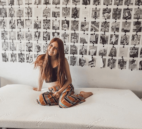 Woman Posed Smiling on Topper Supreme in Bedroom