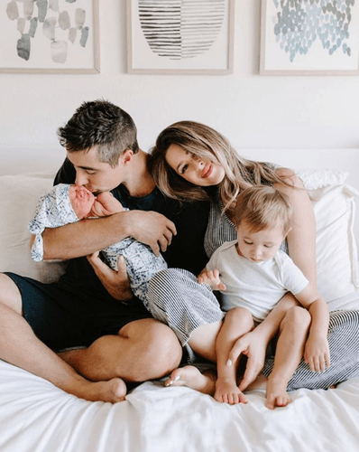 Family Posing on Bed