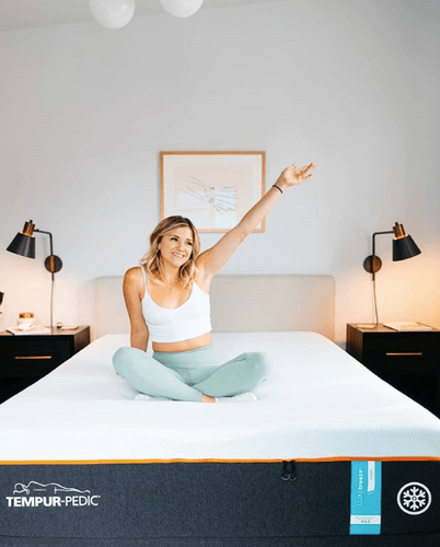 Woman Smiling and Posing on Mattress