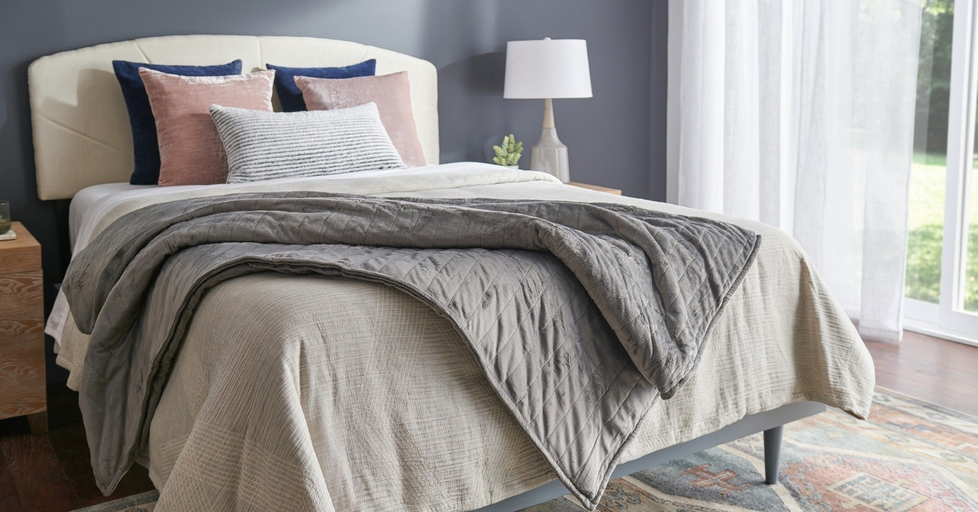 Weighted Blanket unfolded on a dressed bed